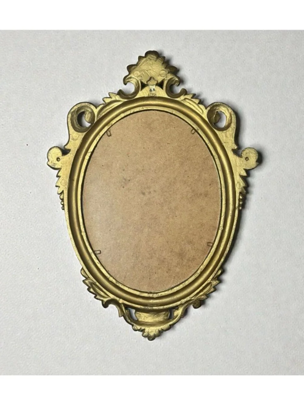 Ornate Gold Oval Mirror With Floral Details & Vintage Frame Design